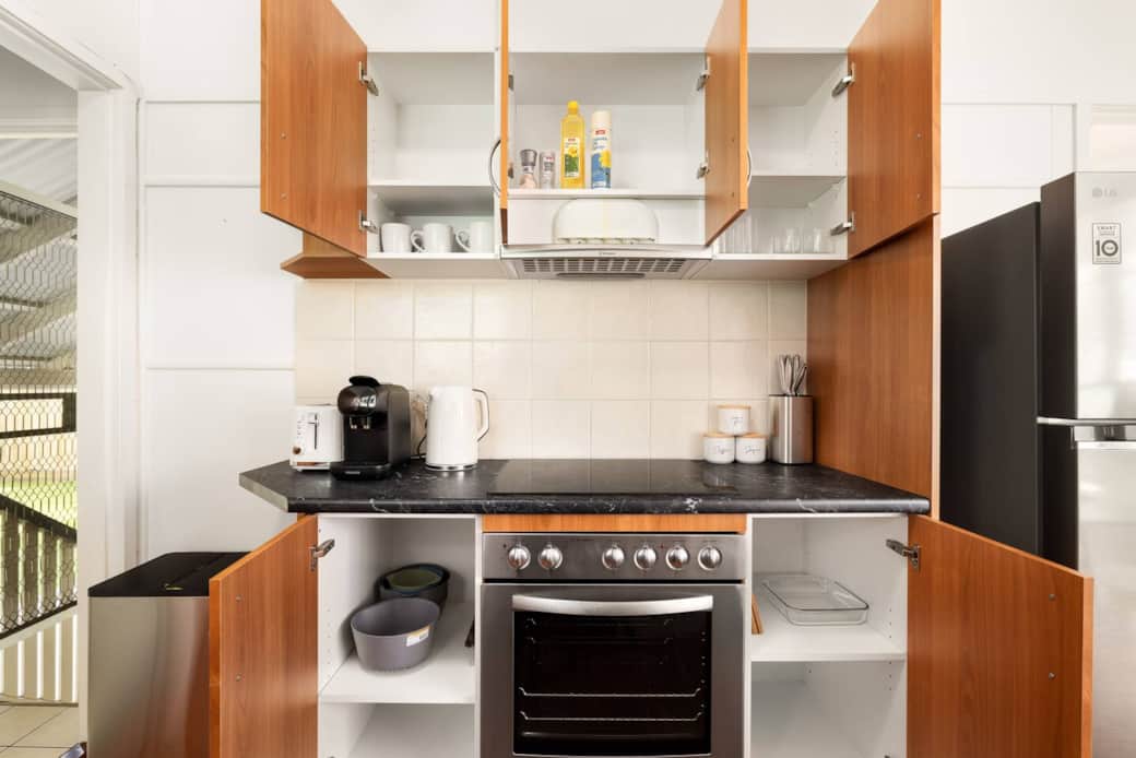 Kitchen: Sleek kitchen with ample storage, modern appliances Kitchen: Sleek kitchen with ample storage, modern appliances