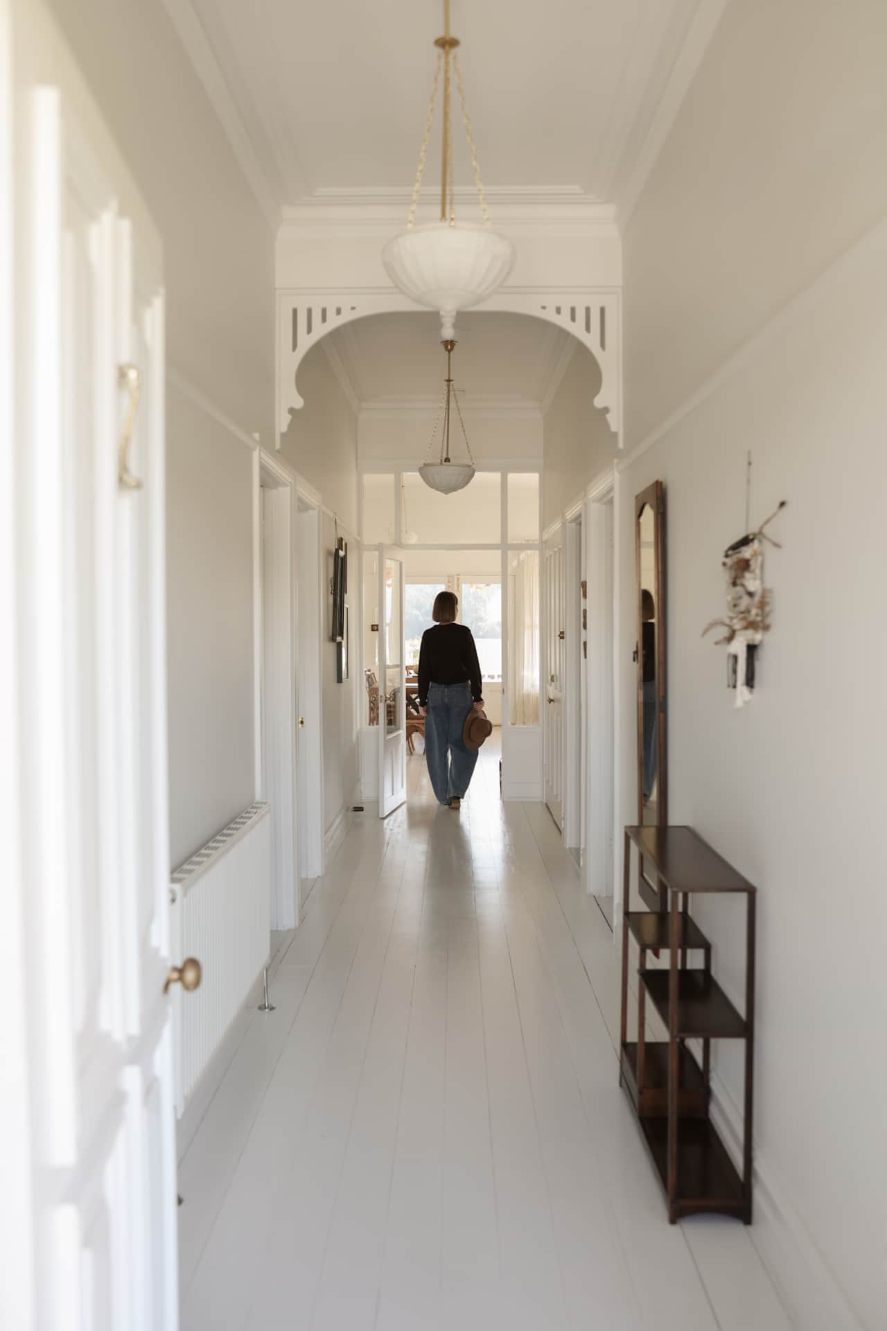 Dufflebird Farm all-white hallway, Berrys Creek VIC, pared-back interior with space to breathe