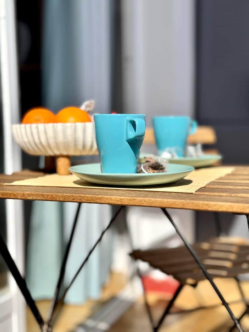 Experience a cozy balcony, perfect for breakfast and relaxation.