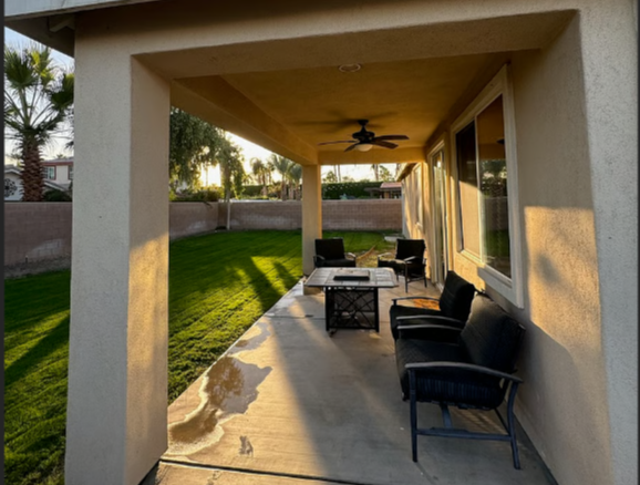 Soak in the warm air on the covered varanda with firepit