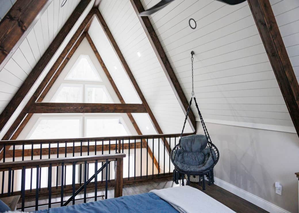 Loft bedroom with hanging swing chair