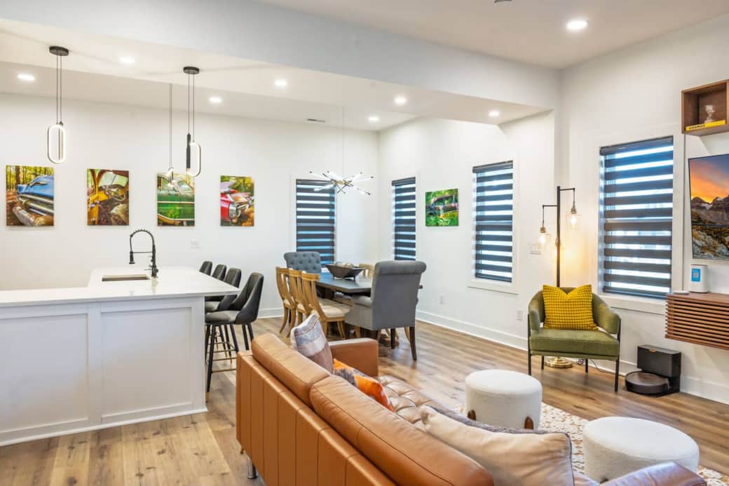 Open concept main floor with plenty of windows with roller shades allowing you to customize the amount of light vs. privacy. Enjoy one-of-a-kind photography throughout the home, created by the host.