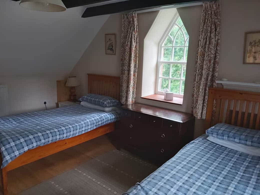 Twin bedroom 1. Includes sink with mirror, wardrobe, bedside cabinets and chest of drawers . Feature