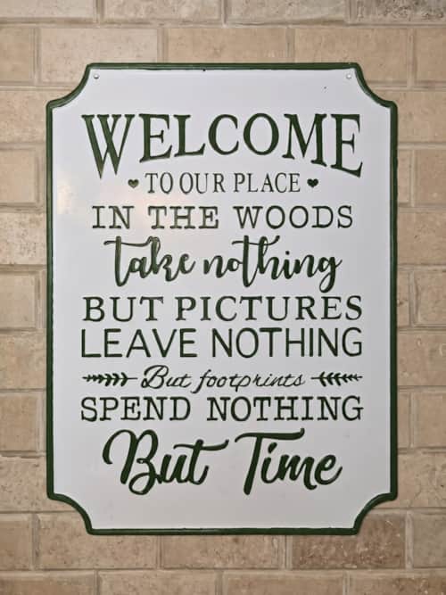Welcome to our place in the woods sign at Dutch Hill Retreat