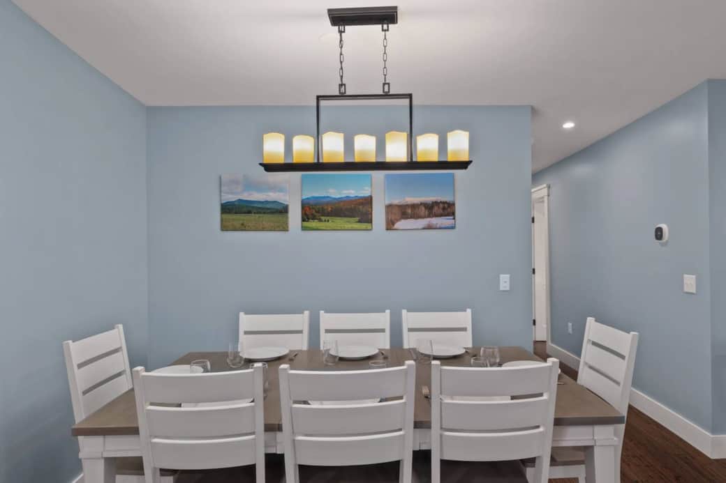 The large dining table seats 8 and is the perfect place for enjoying a meal or game with the family.