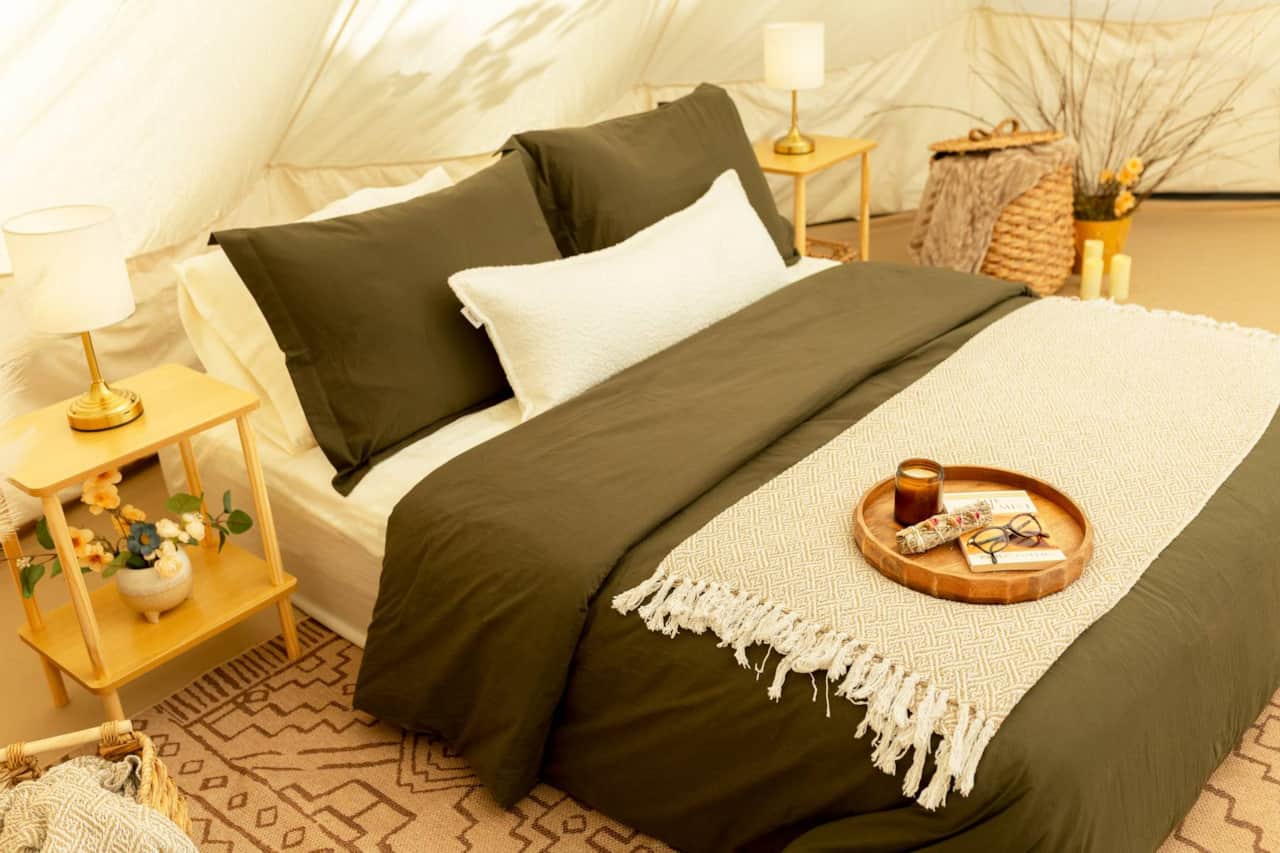 A Cozy Queen Bed Surrounded by Calming Natural Tones