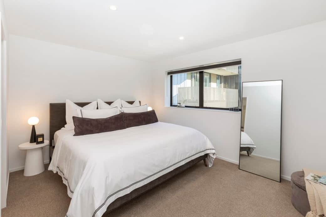 Master bedroom with Californian king bed and walk in wardrobe.