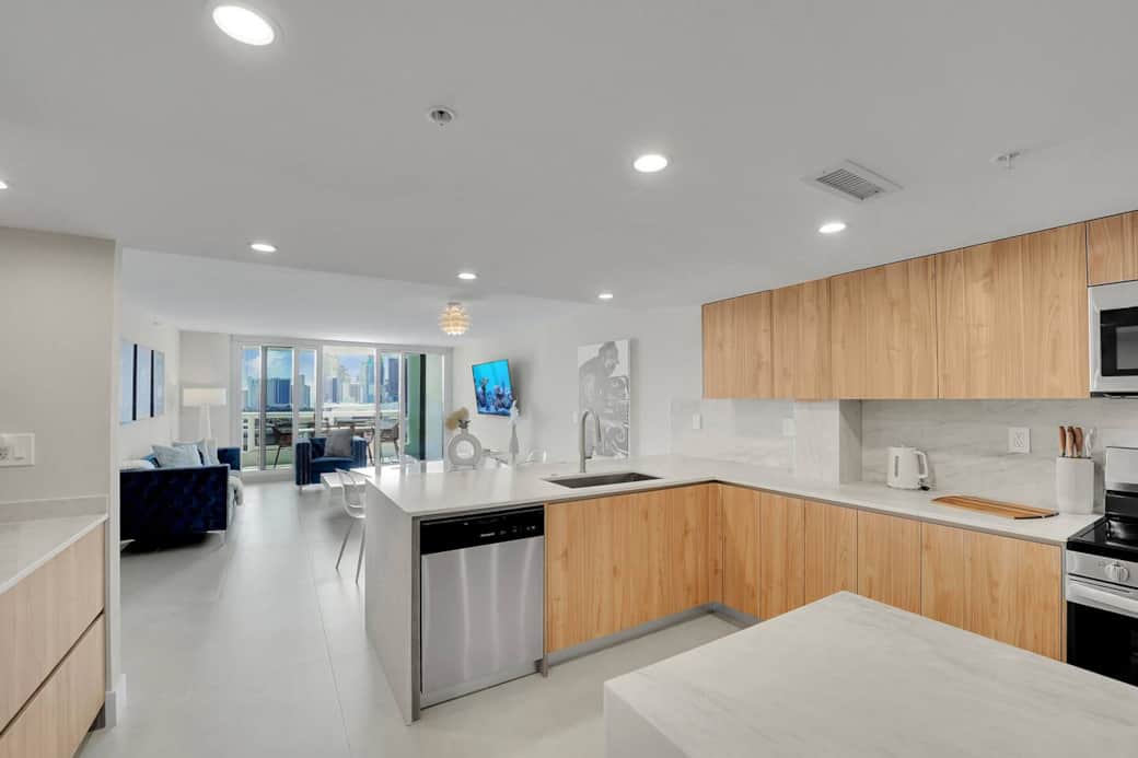 Fully equipped kitchen, coffee bar, dining area with seating for 6, living room with balcony access and Roku streaming tv