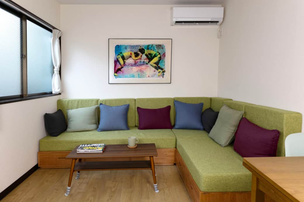Relax in the cheerful, air-conditioned lounge—perfect for couples or digital nomads Relax in the cheerful, air-conditioned lounge—perfect for couples or digital nomads