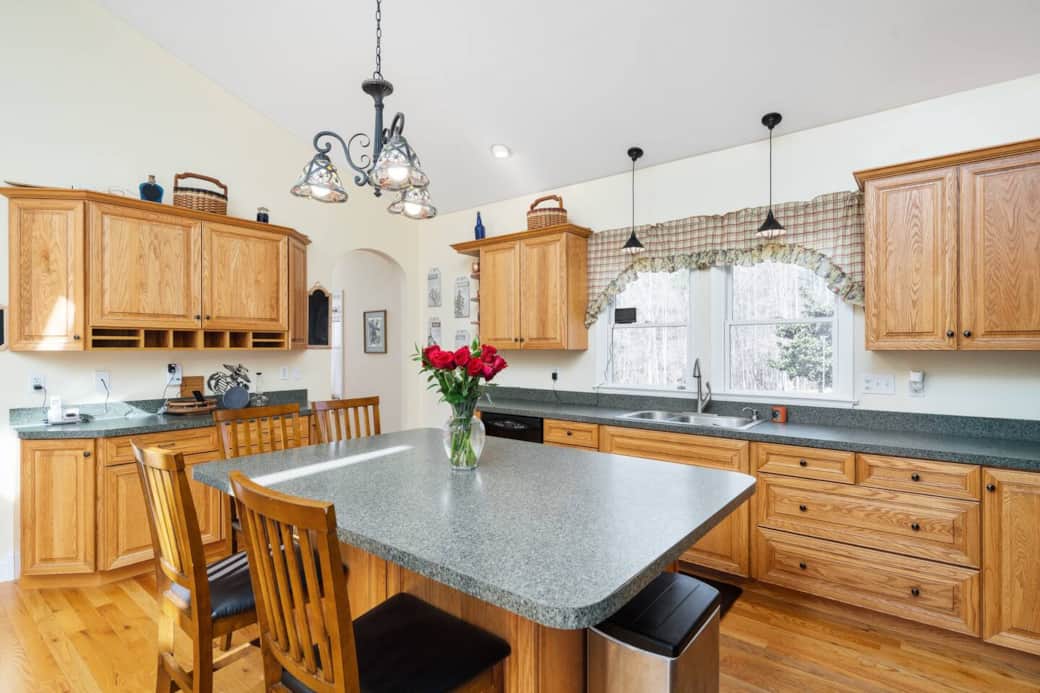 Open kitchen and bar area that leads to living room.