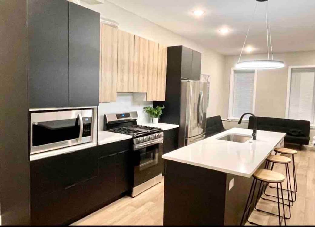 Big kitchen with breakfast bar.
Dishwasher , oven range , microwave, 33 inch refrigerator. 
Connected to a big living room , full bathroom room, and 1 bedroom in back on the same floor.