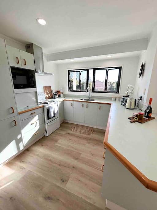 Sunny, spacious kitchen overlooking the back garden. Includes Rice Cooker and Nespresso Coffee