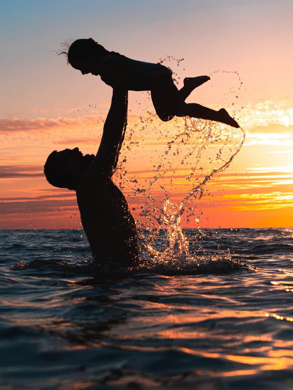 Redington beach father daughter sunset vertical