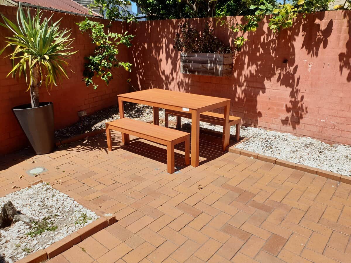 Table and benches in the courtyard.