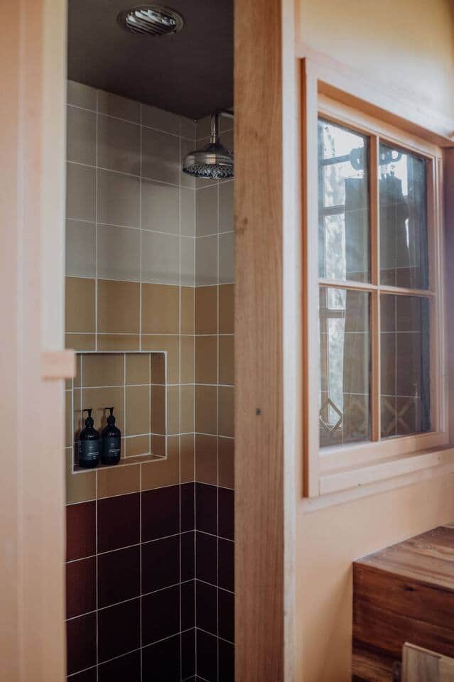 A retro-inspired shower, with rain water head and plenty of hot water. Milie Organics Shampoo & Conditioner provided for guest use.