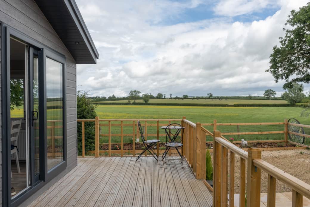 Private deck with far-reaching views across rolling Cotswold countryside