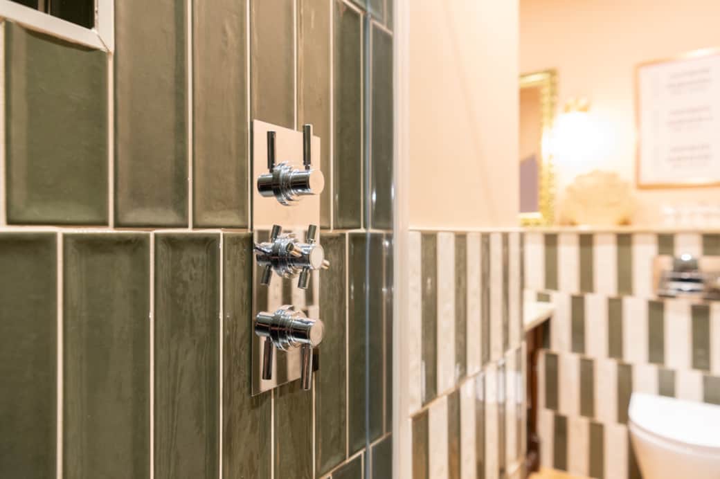 Romantic touches like ambient lighting and soft throws create a cozy, indulgent escape.