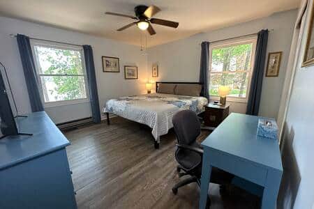 The spacious master bedroom has a king bed and lake view The spacious master bedroom has a king bed and lake view