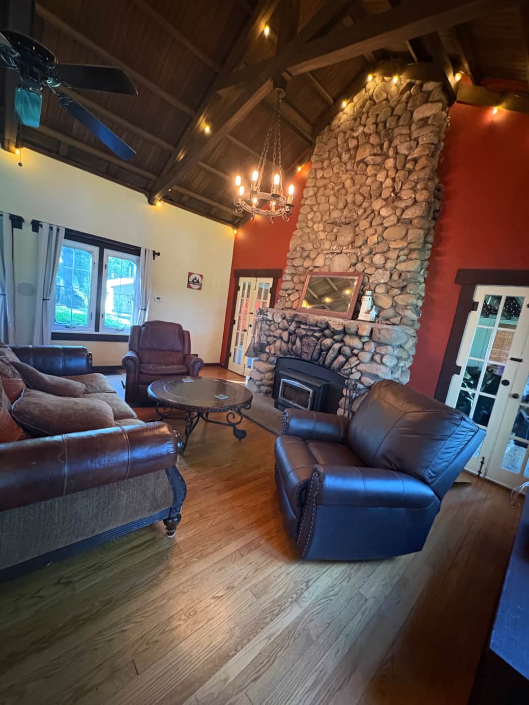Fire Place has totem pole rock inlay of a rabbit on top of a bull