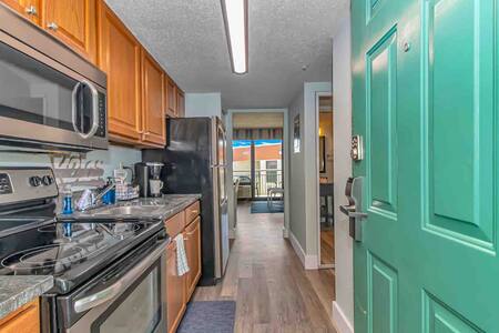 Entryway featuring fully stocked kitchen with stainless steel appliances and Keurig!