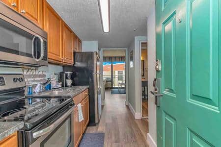 Entryway featuring fully stocked kitchen with stainless steel appliances and Keurig!