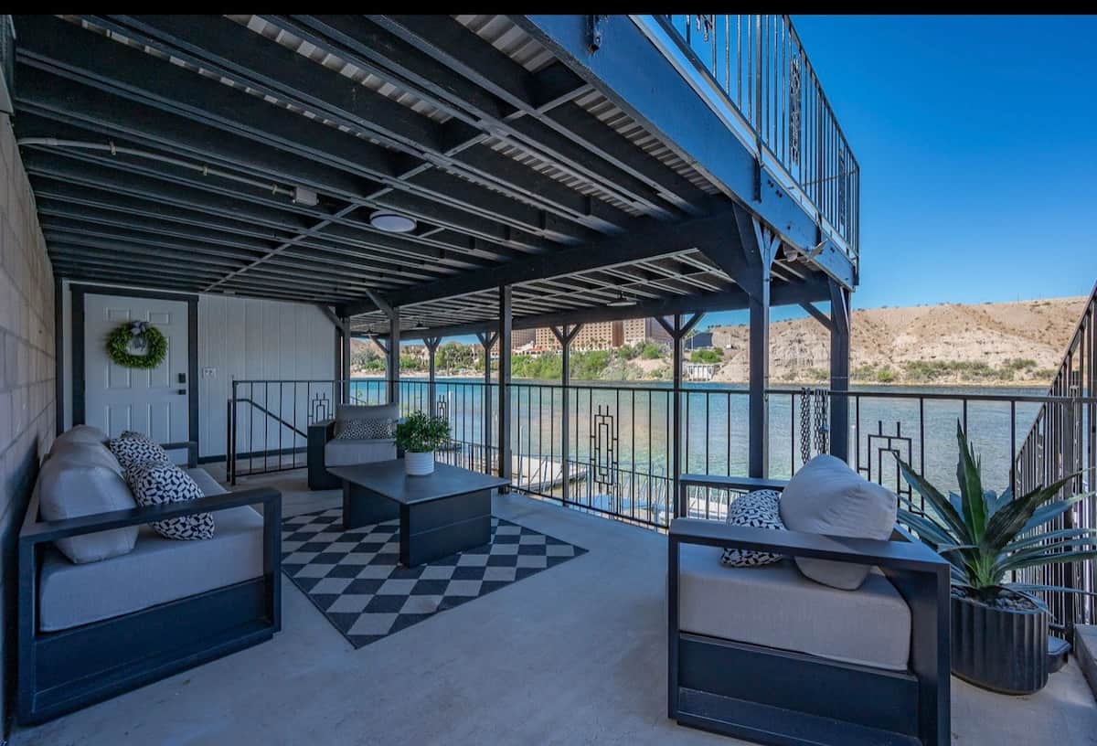 Indulge in the serenity, private covered balcony with luxe lounge seating overlooking sparkling water and desert mountains. Enjoy serene morning and golden sunsets, with a stunning resort view creating an elevated, exclusive escape . 