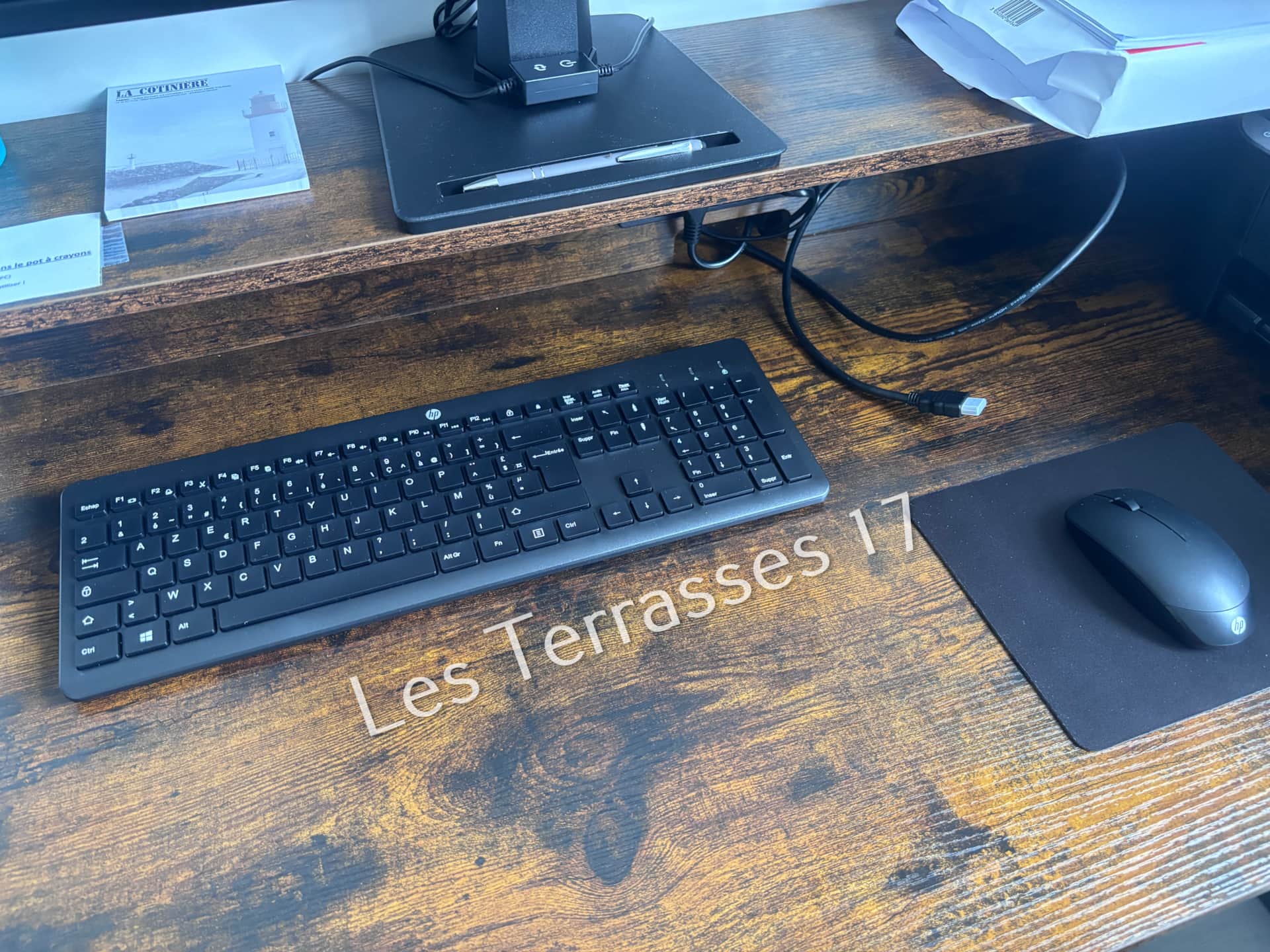 Equipped desk with monitor, keyboard and mouse for remote working