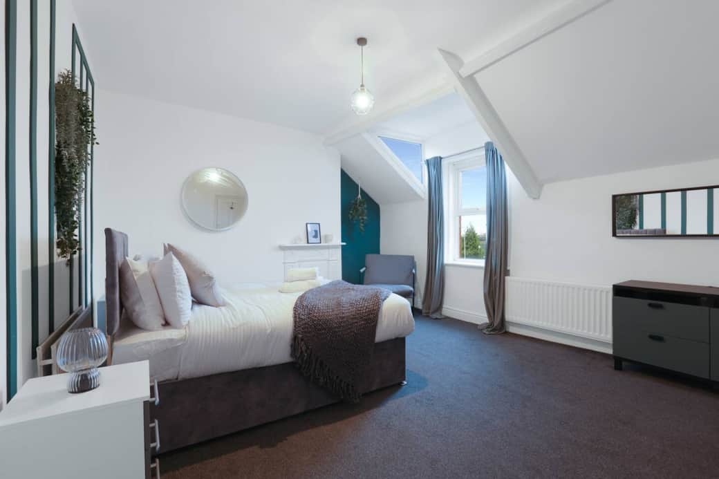 Spacious and calming master bedroom with a plush double bed, cosy armchair, and plenty of natural light — the perfect retreat to unwind after a busy day. Spacious and calming master bedroom with a plush double bed, cosy armchair, and plenty of natural light — the perfect retreat to unwind after a busy day.