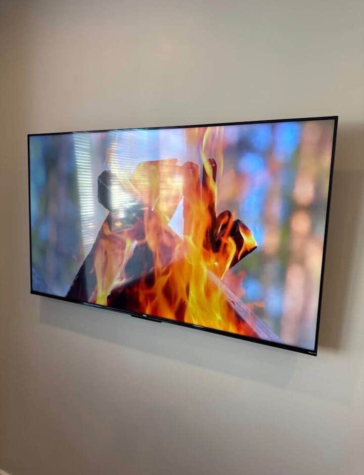 large flatscreen TV with Roku channels