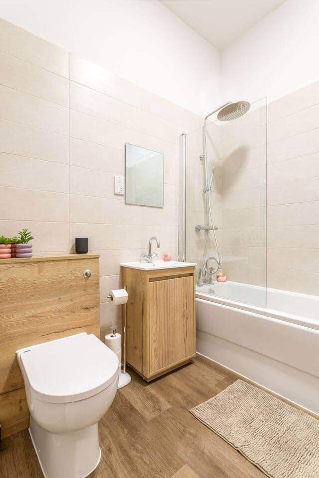 Bathroom with over bath shower 