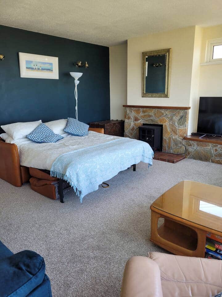 This is a full sized double sofa bed with a superior mattress. There full black out blinds and lots of seating elsewhere in the house. Refer to our social media page to see a video showing how easy it is to open and close up the bed. 