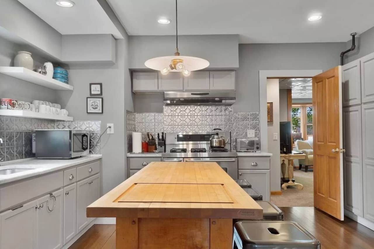 Modern, well-stocked kitchen with large butcher block island at Berkshire Vacation Home.
