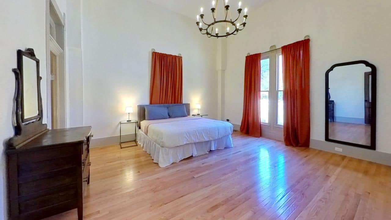 Comfortable bedroom at The Wildflower House with historic touches and modern updates