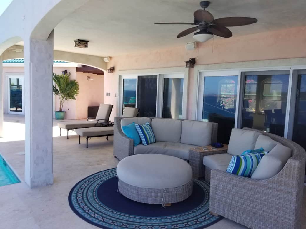 Expansive covered porch and sunny pool patio