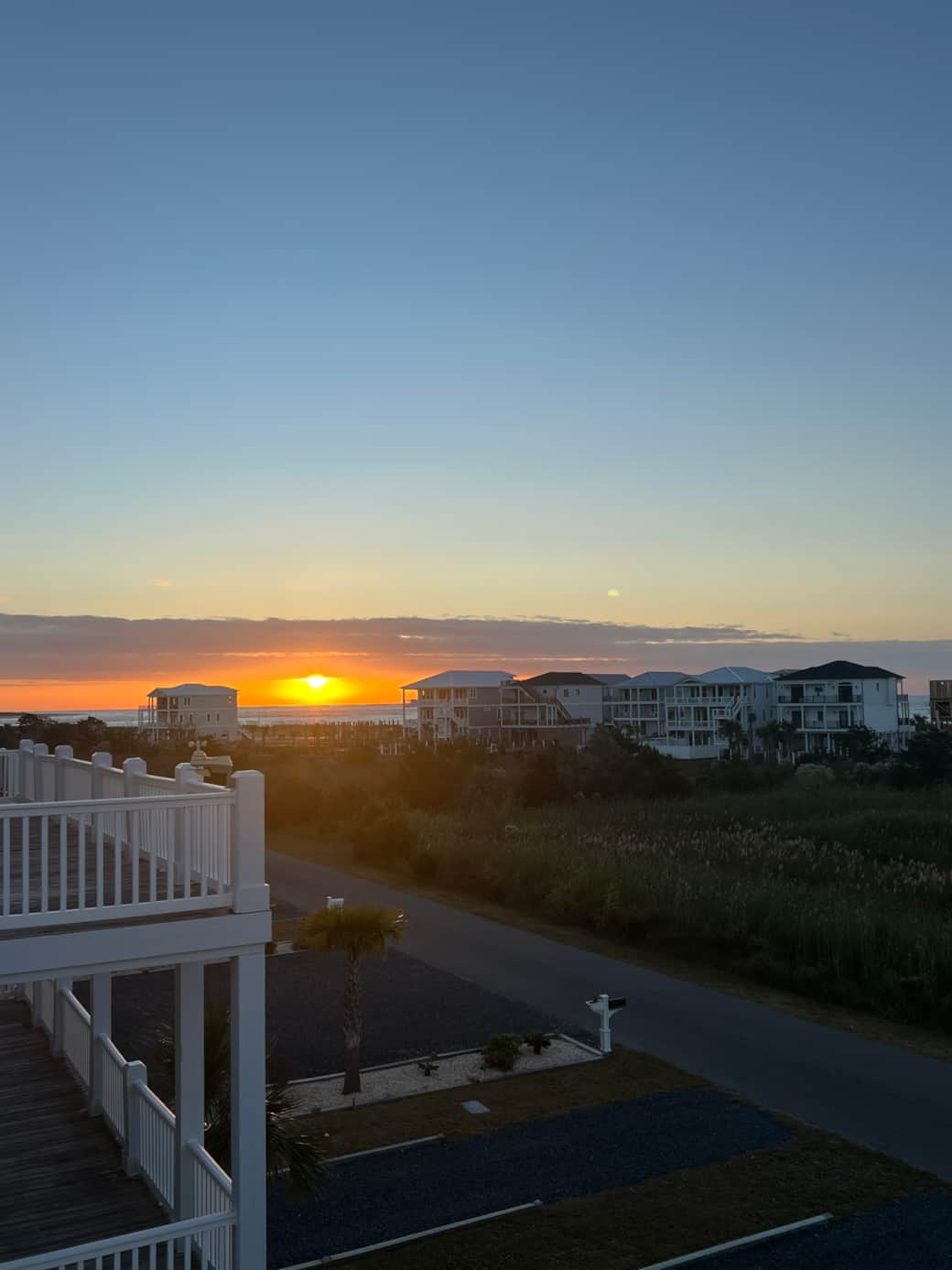 Sunrise from front upper level deck accessed by primary bedroom and queen bedroom