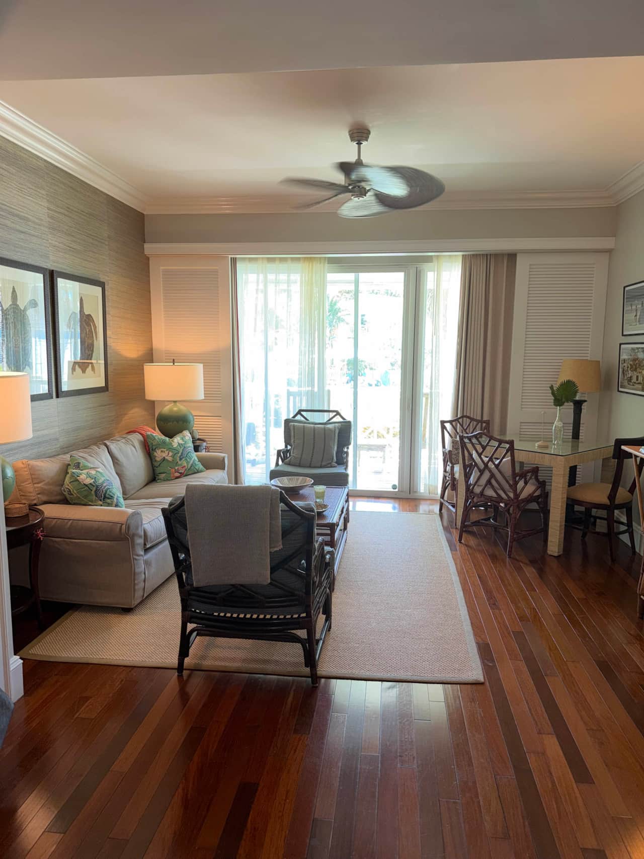Relax in our open-concept Harbour Island living and dining space, featuring bright balcony views