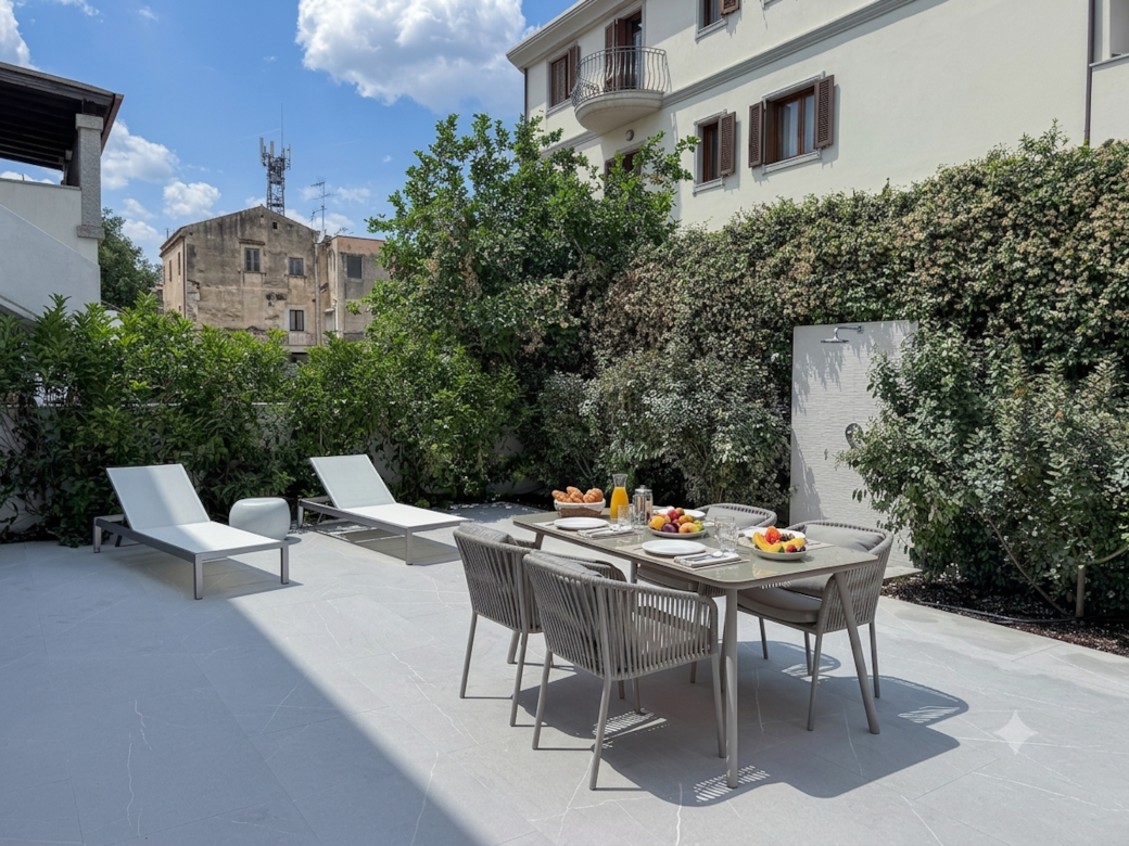 AZULIS DelleTerme Suites Apartment1 open outdoor terrace area with rain shower and 4 person dining t