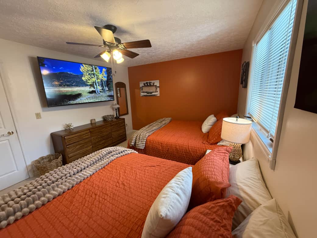 Two Queen Beds, 65” TV Two Queen Beds, 65” TV