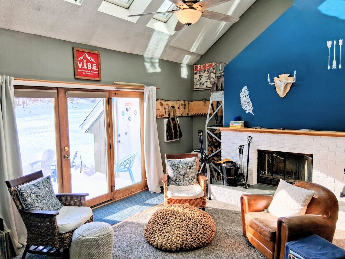 Sun-soaked seating  around a charming fireplace, perfect for après-ski evenings! Ski-In/Ski-Out  