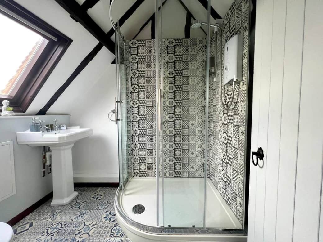 Sleek shower awaits. Book your escape now with Top Stay Hosts serviced accommodation. Long and short stays welcome.