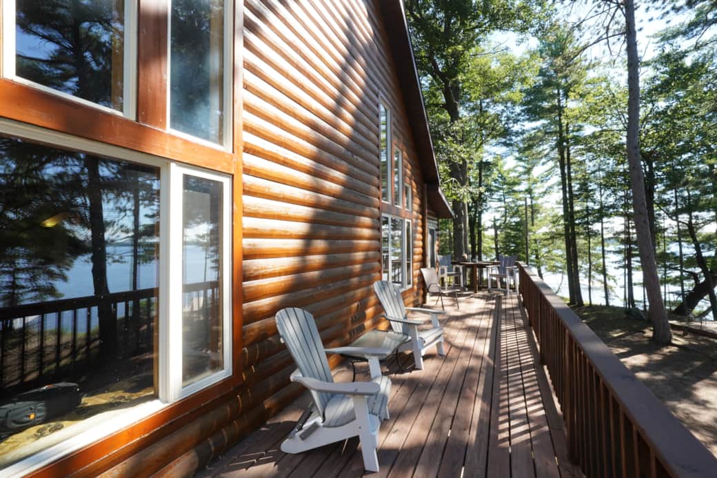 Porch with seating and a beautiful lake view. 