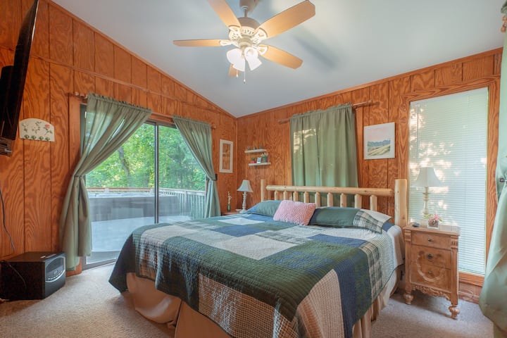 Nestled in nature: Experience ultimate comfort in the cabin's secluded master king-size bedroom.