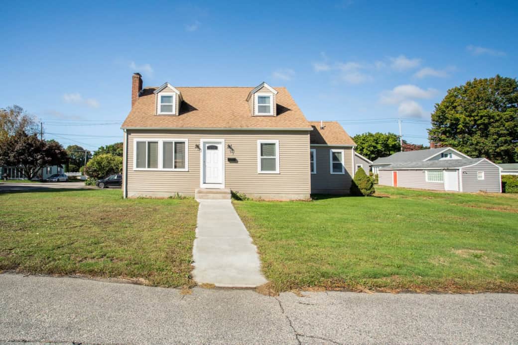 Charming Exterior: Enjoy sunny days in this welcoming yard with easy access to local adventures!