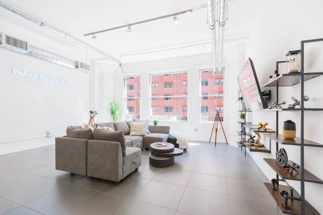 Welcome to our bright living room, with natural light, cozy seating, and a big TV. Welcome to our bright living room, with natural light, cozy seating, and a big TV.