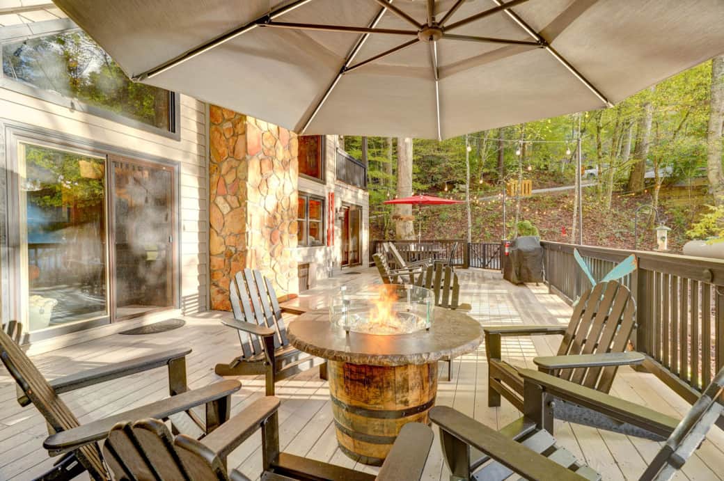 Beautiful whiskey barrel gas firepit with outdoor seating on back deck Beautiful whiskey barrel gas firepit with outdoor seating on back deck