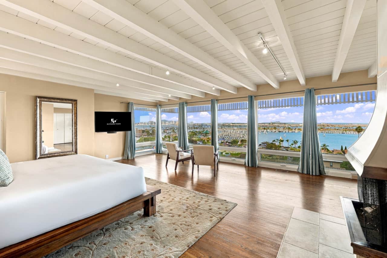 Primary Suite with Panoramic Marina Views & Fireplac