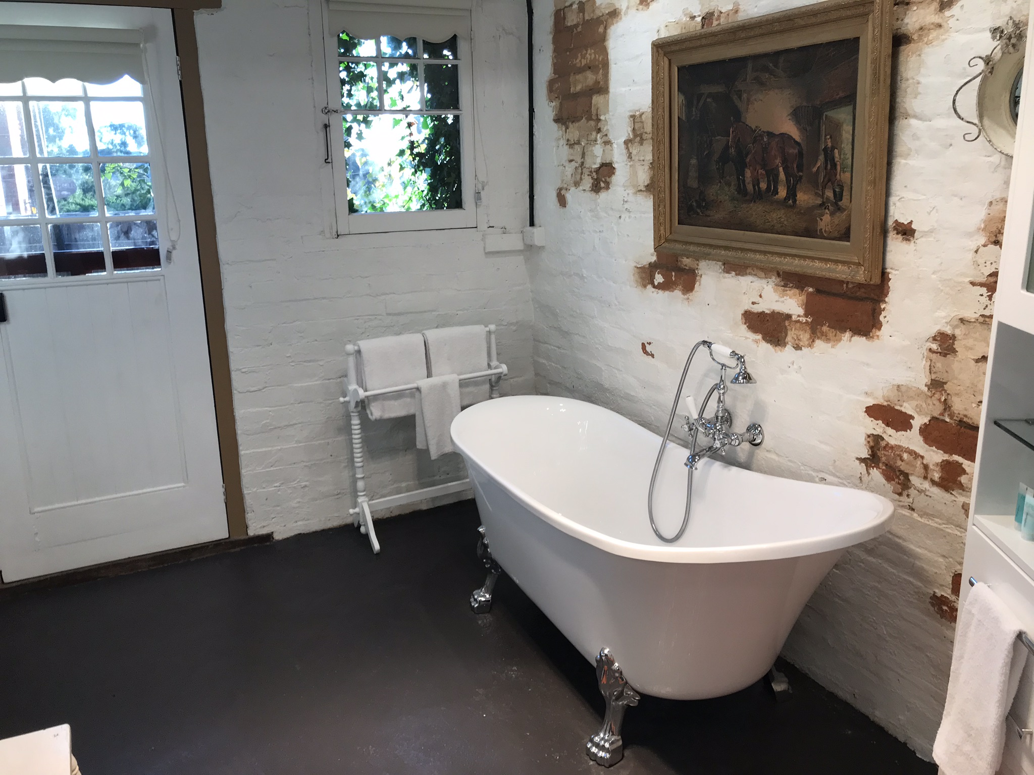 Bathroom with clawfoot bathtub and shower