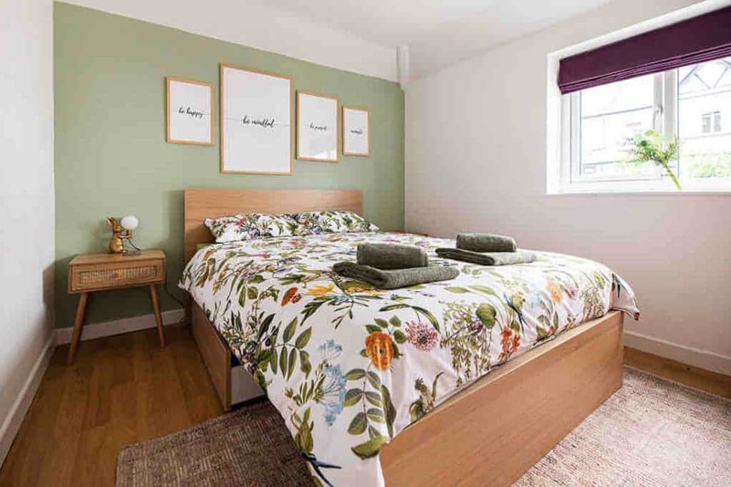 Second bedroom boasting garden views
