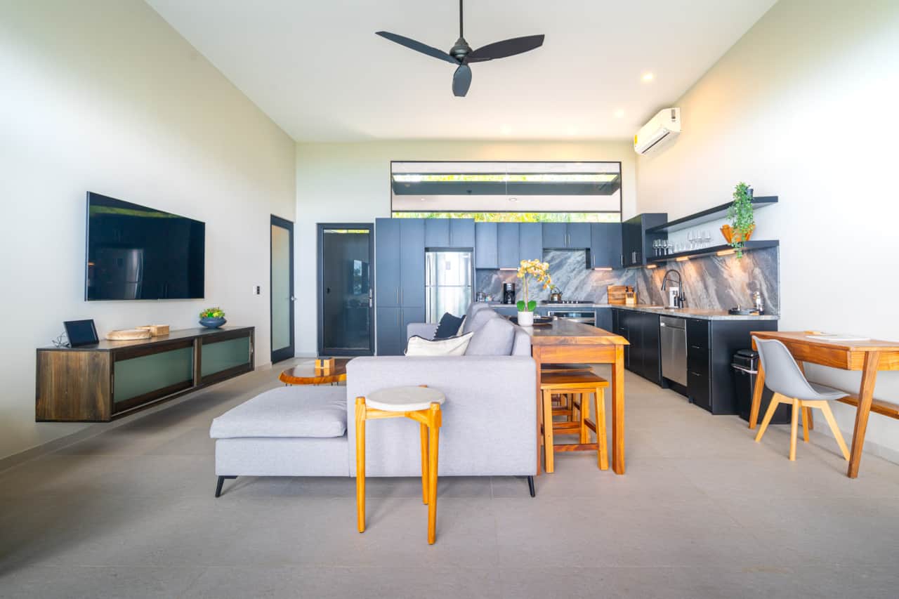 Bright great room with smart TV, dining and full kitchen