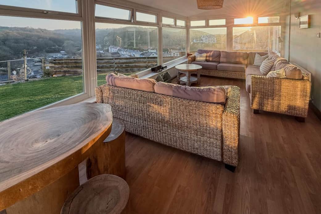 The sunroom enjoys both sunrise and sunset and all the skies in between. Our guest reviews rave about this space, with its panoramic views of the village and cows and sheep on the fields above.
A very relaxing place to be. The sunroom enjoys both sunrise and sunset and all the skies in between. Our guest reviews rave about this space, with its panoramic views of the village and cows and sheep on the fields above.
A very relaxing place to be.